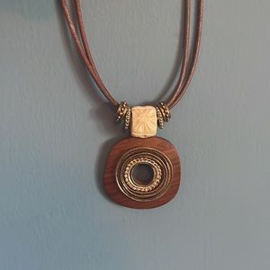 Chico’s unique double leather strap and adjustable chain necklace